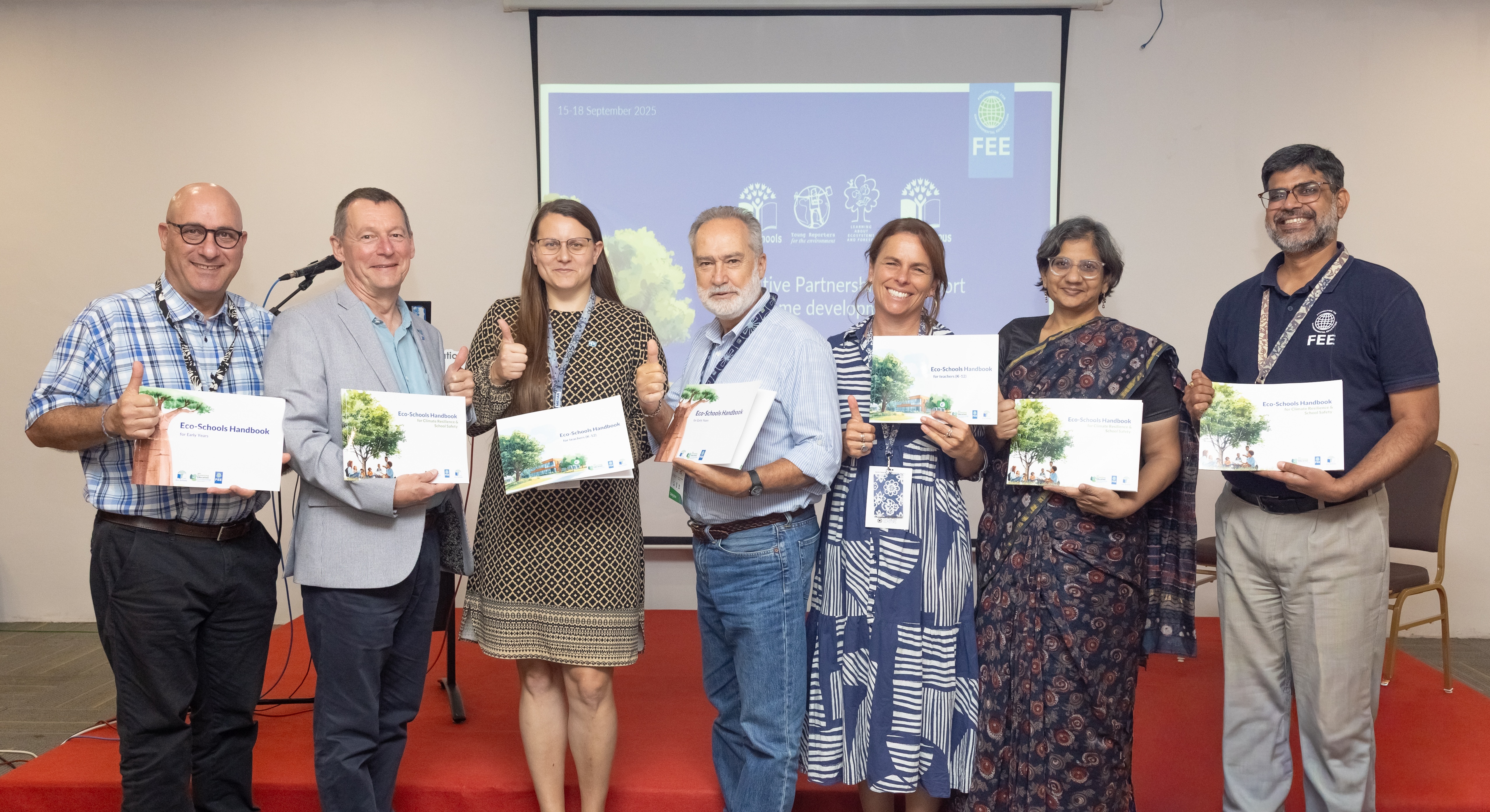 At FEE’s 2025 National Operators Meeting, FEE and PPG representatives celebrated the worldwide launch of new Eco-Schools materials.